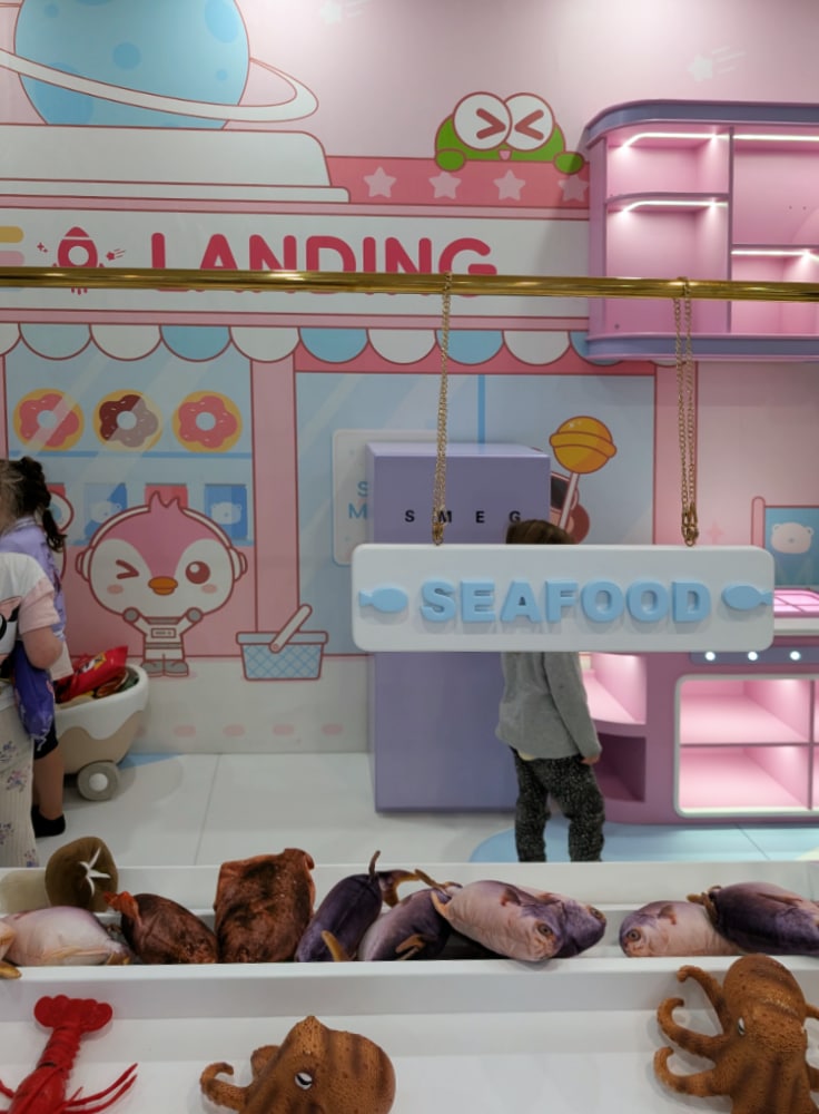 NEW Landing Play Centre Altona North 7 Kids playing in a pastel pretend shop with a “SEAFOOD” counter and toy fish at Landing Play Centre Altona North